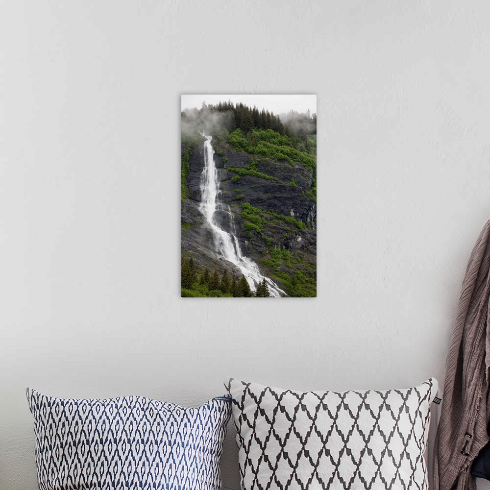 A bohemian room featuring USA, Alaska, Prince William Sound, waterfall in rainforest along Harriman Fiord on rainy summer a...