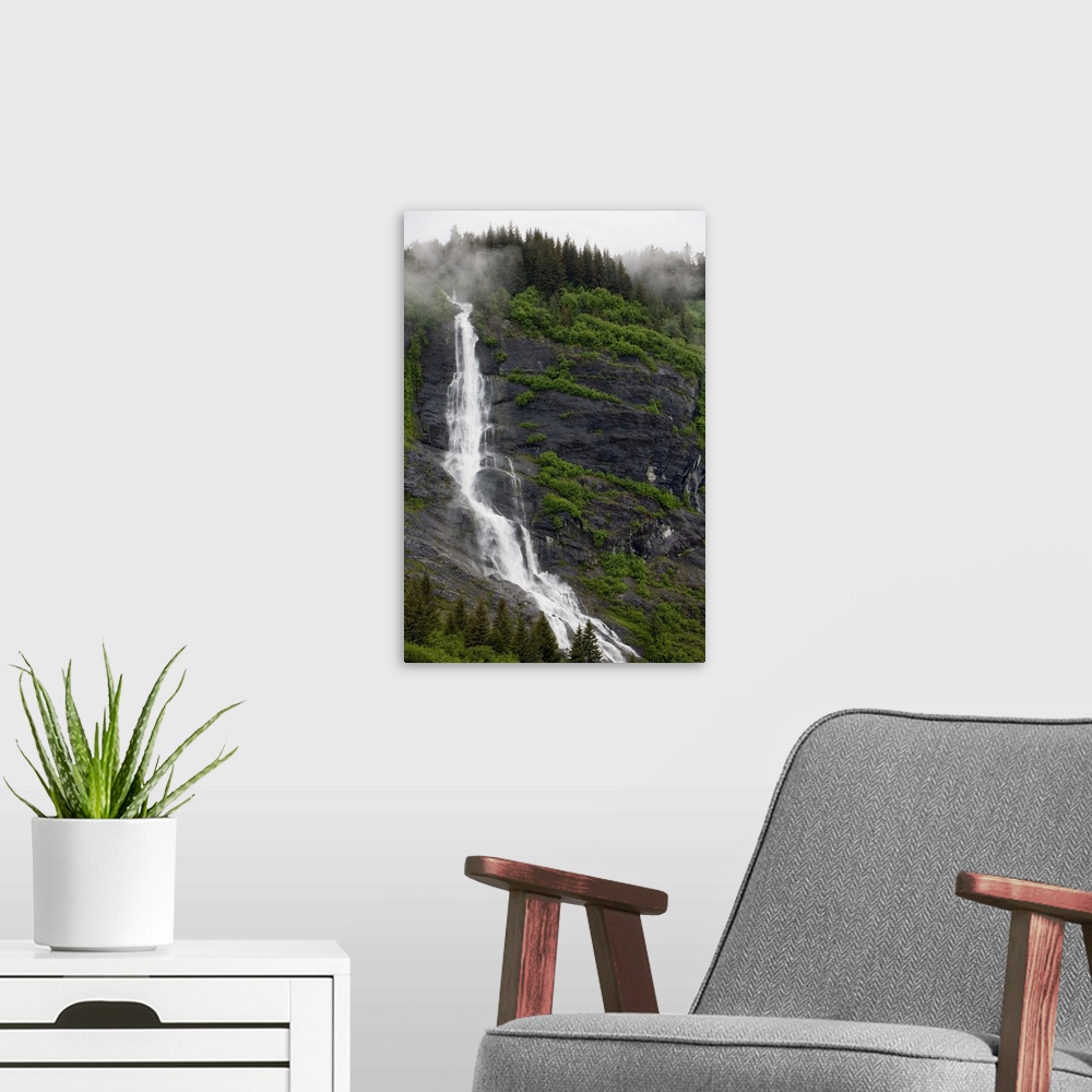 A modern room featuring USA, Alaska, Prince William Sound, waterfall in rainforest along Harriman Fiord on rainy summer a...