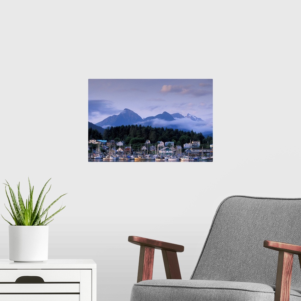 A modern room featuring USA, Alaska, Sitka, part of the Sitka fishing fleet tied up, mountains of Baranof Island behind.
