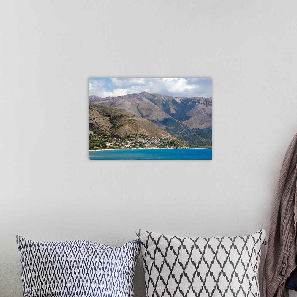 A bohemian room featuring REPUBLIC OF ALBANIA. Qeparo beach with mountainous landscape in the background.