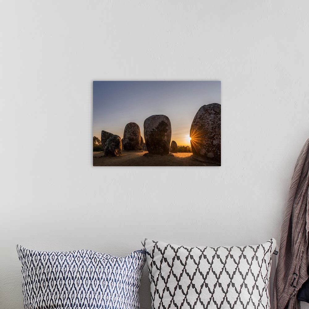A bohemian room featuring Almendres Cromlech (Cromeleque dos Almendres), an oval stone circle dating back to the late neoli...