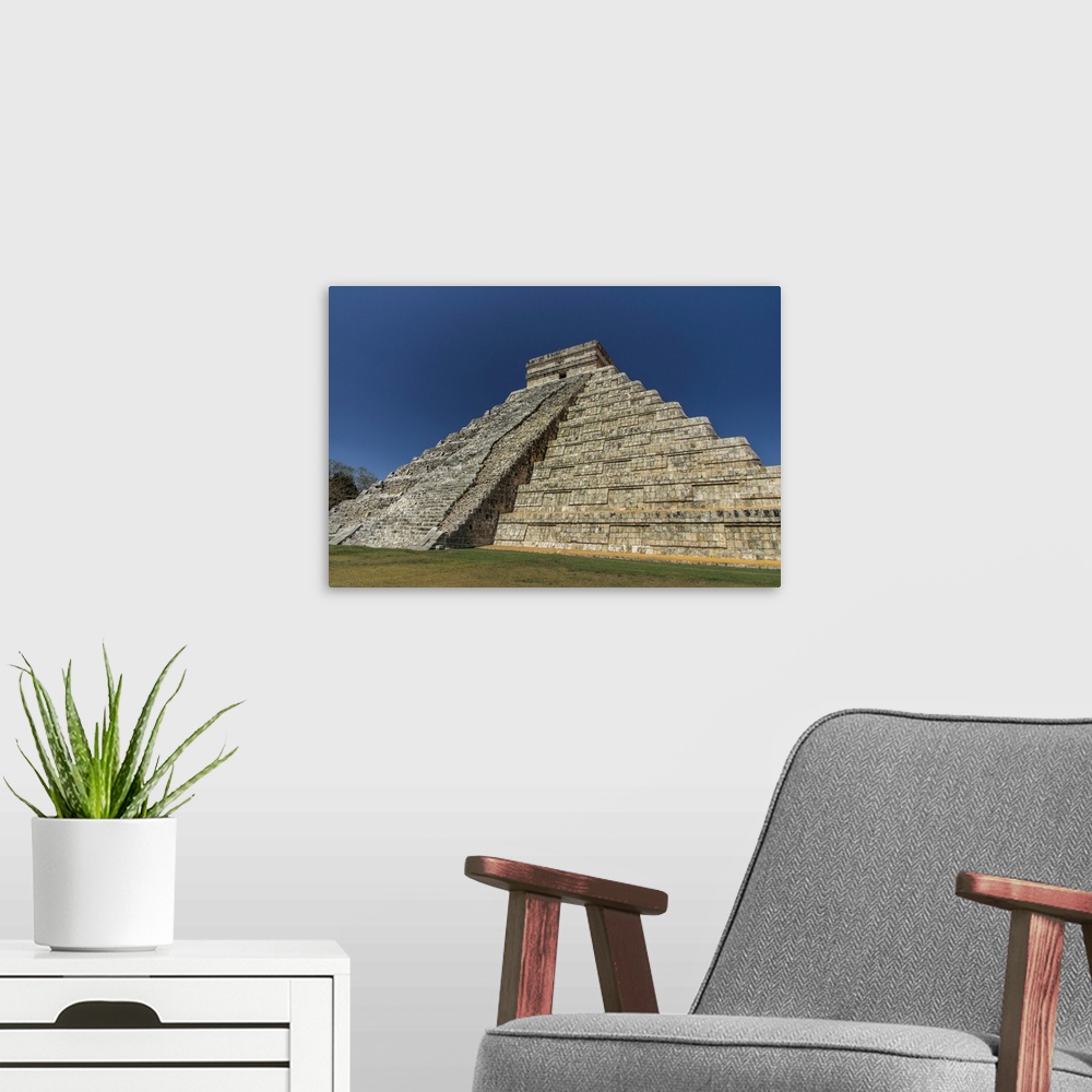 A modern room featuring Ancient step pyramid Kukulkan at Chichen Itza Mexico.