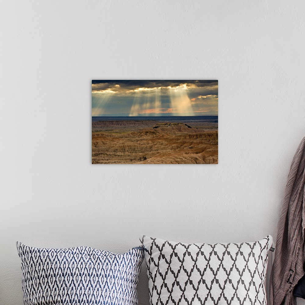 A bohemian room featuring approaching storm and crepuscular rays, sunset, Pinnacles Viewpoint, Badlands National Park, Sout...