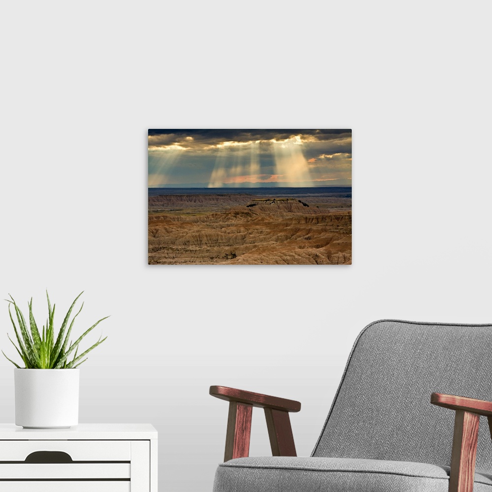 A modern room featuring approaching storm and crepuscular rays, sunset, Pinnacles Viewpoint, Badlands National Park, Sout...