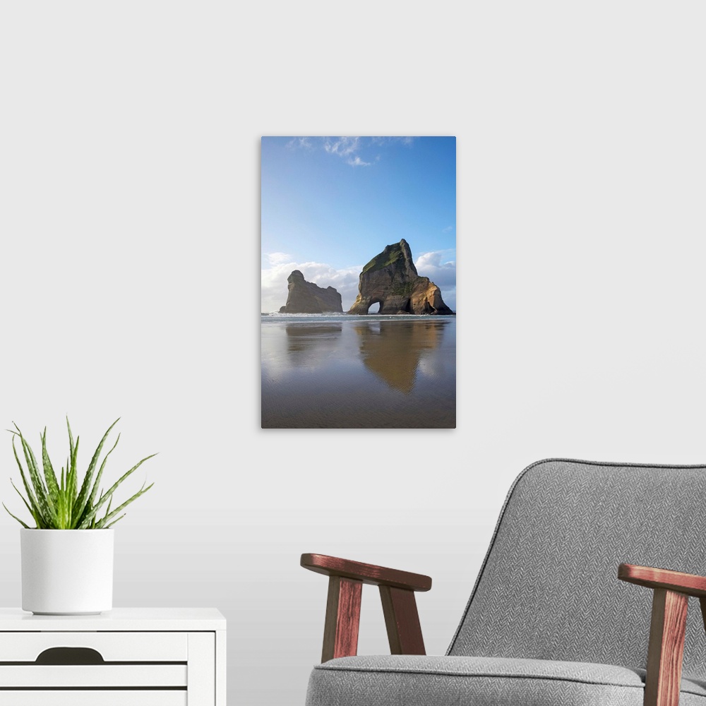 A modern room featuring Archway Islands Reflected in Wet Sands of Wharariki Beach, near Cape Farewell, North West Nelson ...