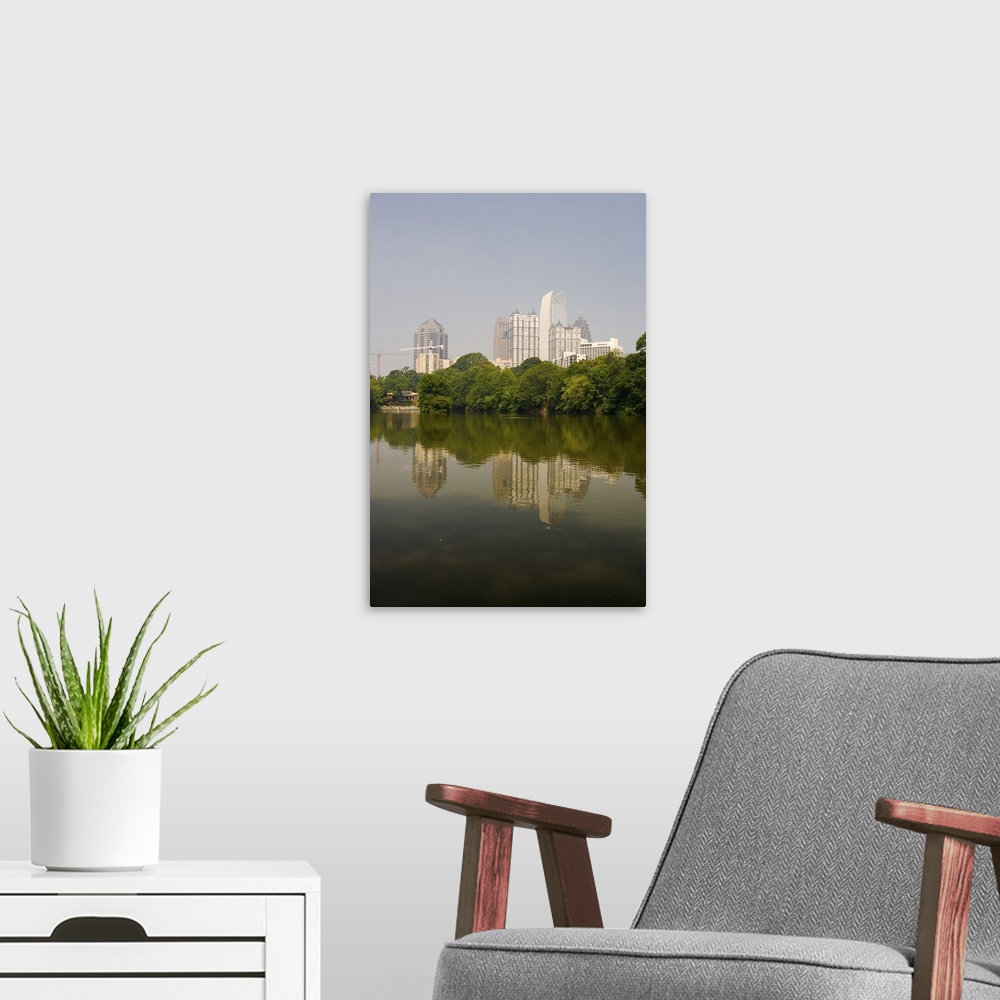 A modern room featuring North America, USA, Georgia, Atlanta. Atlanta skyline and its reflection seen in a pond at Piedmo...