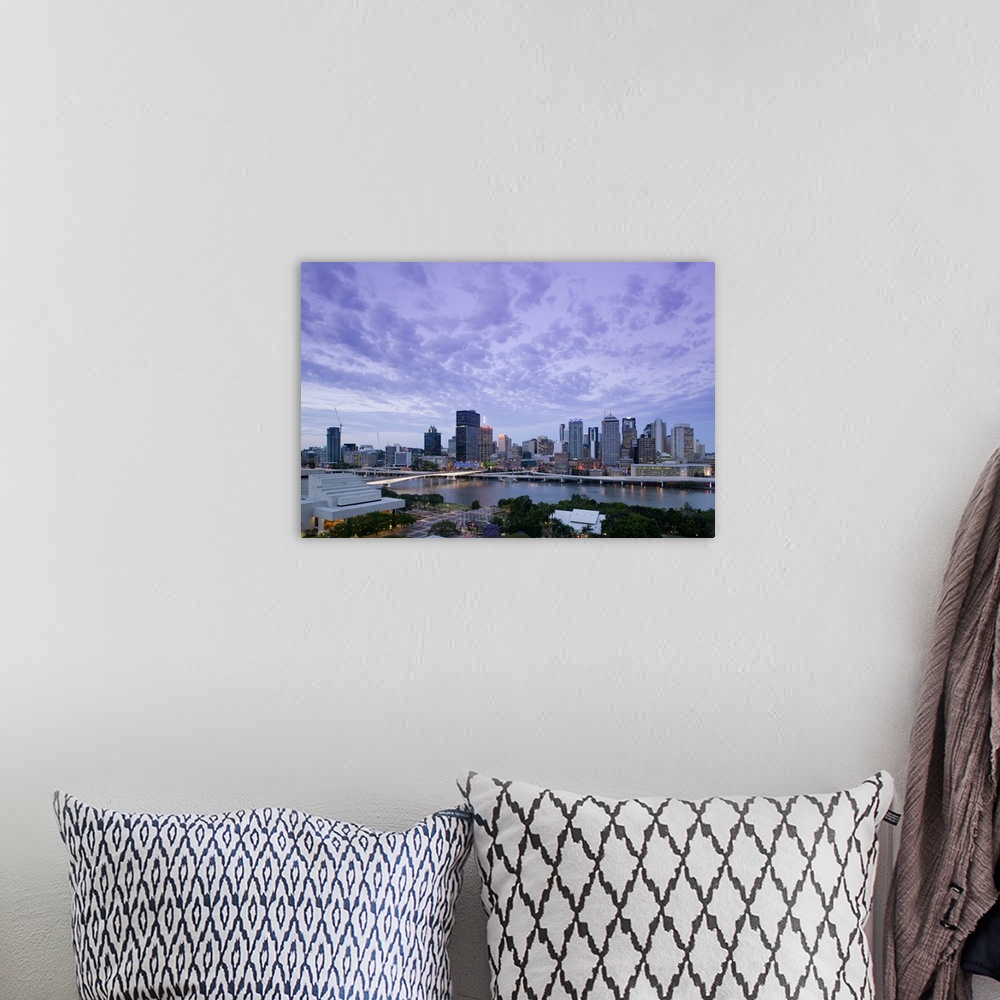 A bohemian room featuring AUSTRALIA, Queensland, Brisbane. City Skyline from Southbank / Evening.
