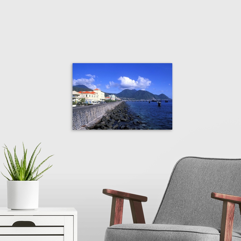 A modern room featuring Bay front with ocean and mountains Capital City of Roseau in Dominica.