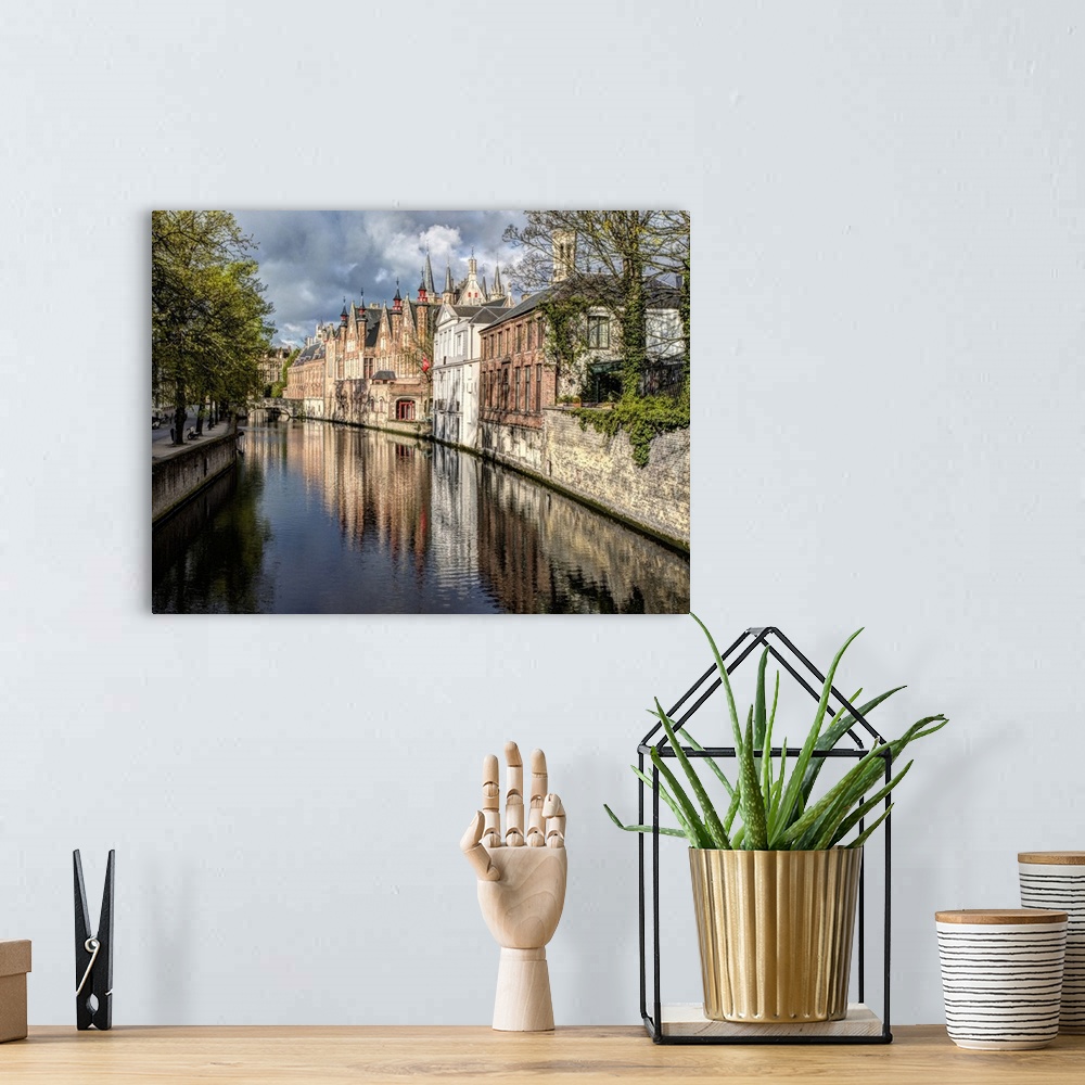 A bohemian room featuring Belgium, Bruges. Reflections of medieval buildings along canal.