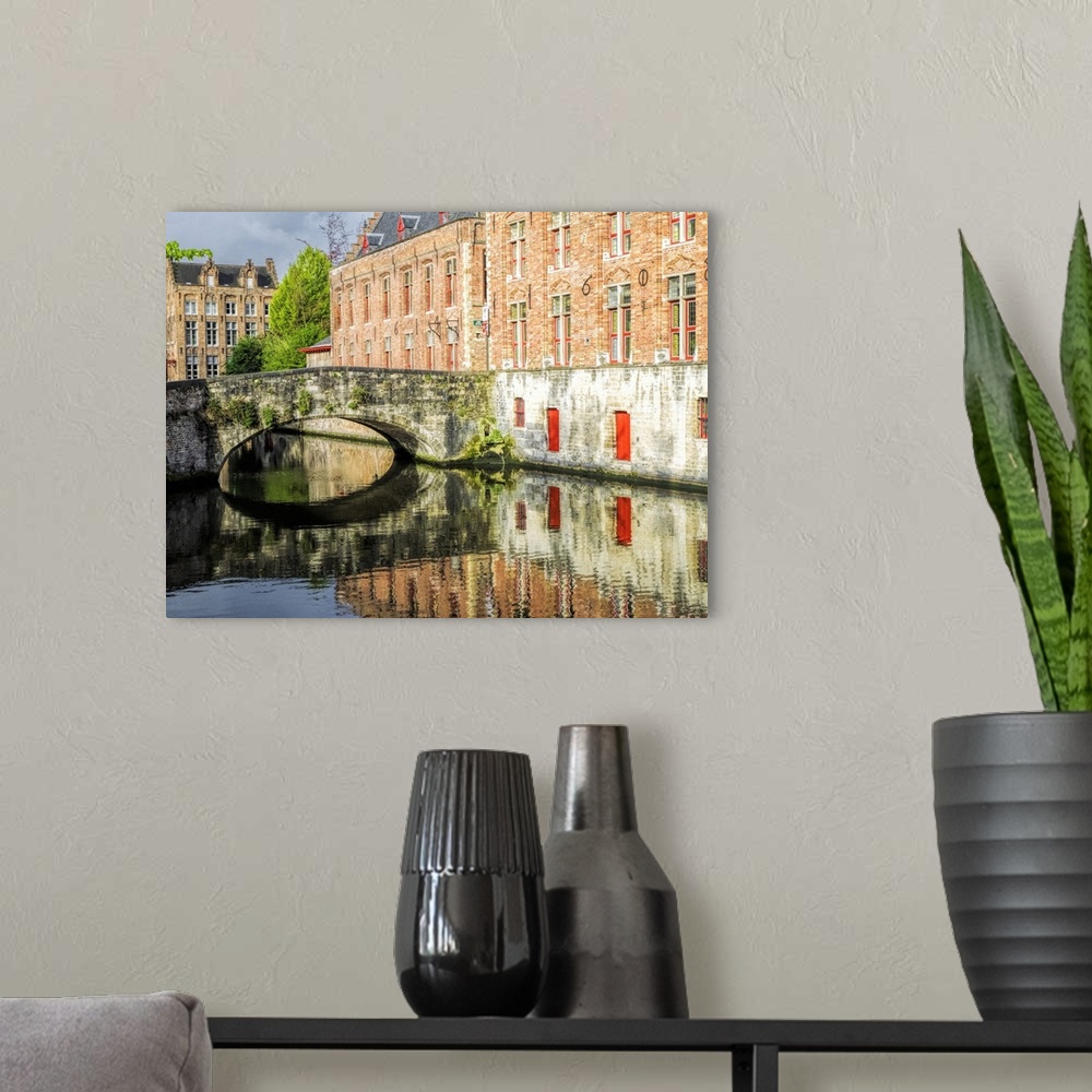 A modern room featuring Belgium, Brugge. Reflections of medieval buildings along canal.