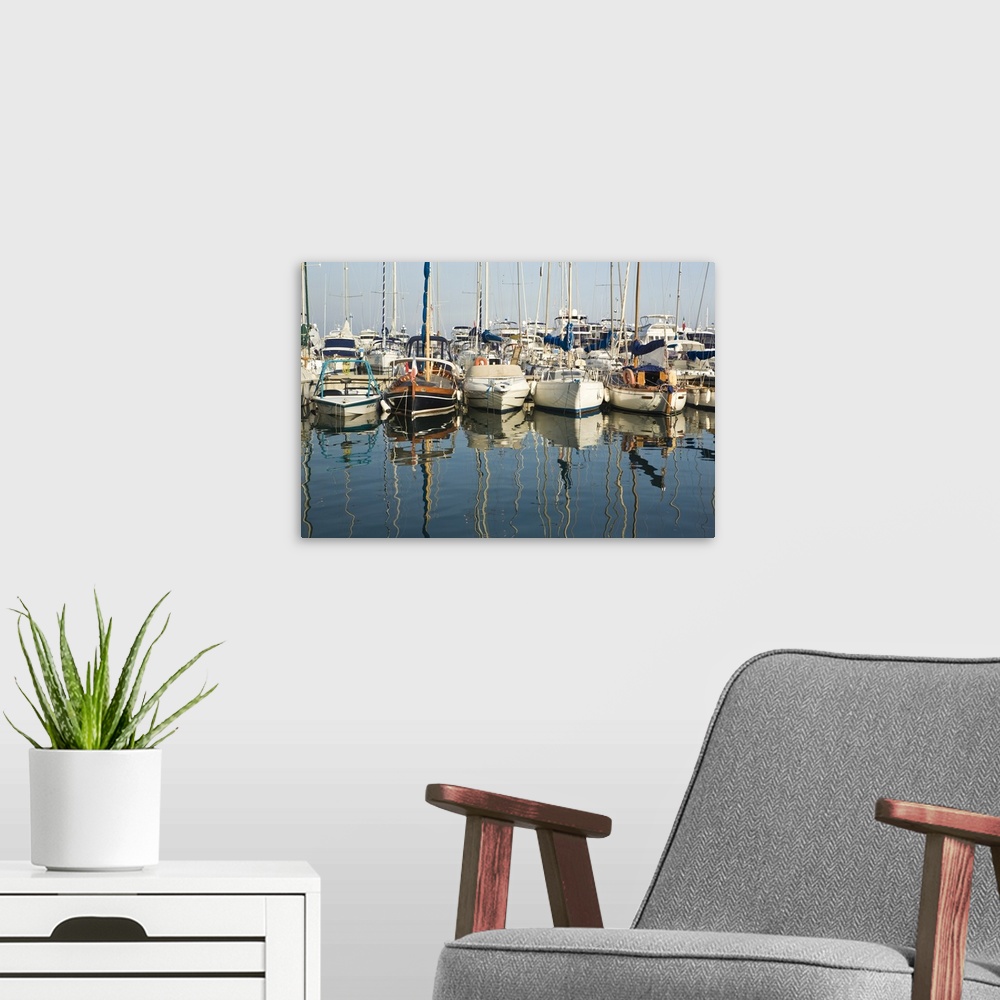 A modern room featuring Boats and reflections in the marina area of Beaulieu sur Mer.  on the coastline in the South of F...