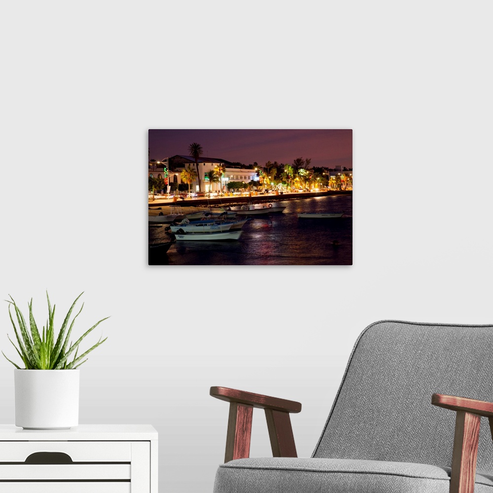 A modern room featuring North America, Mexico, Baja Calfornia Sur, La Paz. Boats and the Malecon seaside promenade. Sunset.