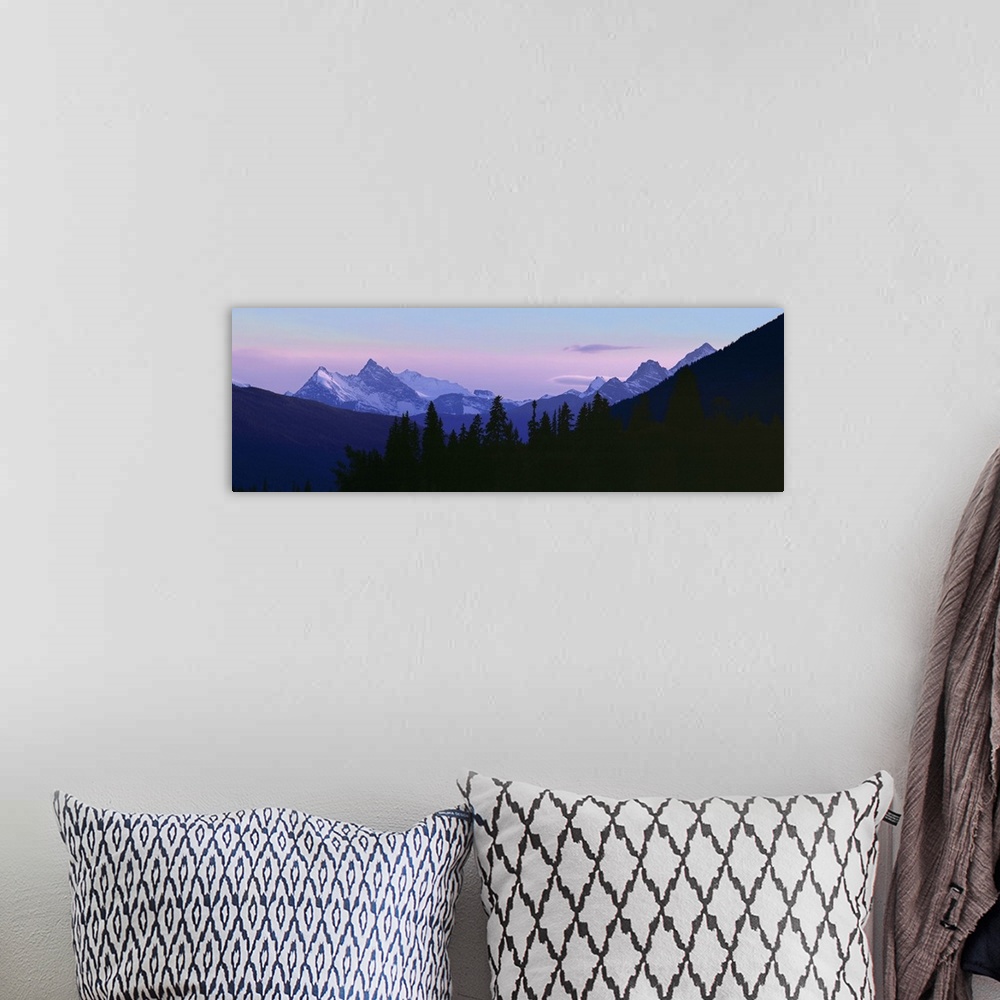 A bohemian room featuring Canada, British Columbia, Mt Terry Fox. Mount Terry Fox turns periwinkle in the settling dusk, Br...