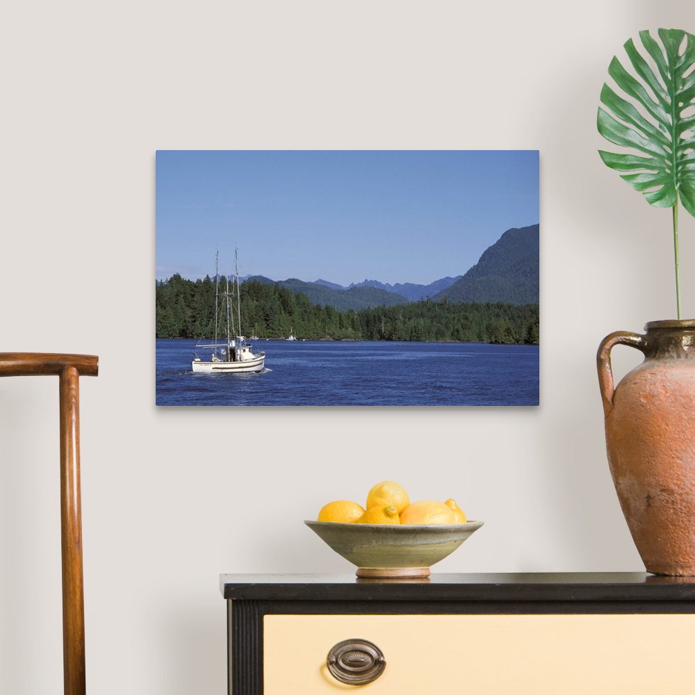 A traditional room featuring Canada, British Columbia, Vancouver Island.Fishing boat from Tofino harbor into Clayoquot Sound