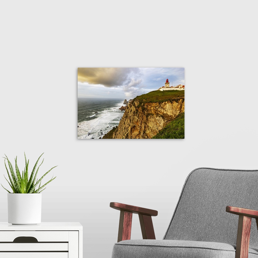 A modern room featuring Cabo do Roca Lighthouse at last light in Colares, Portugal.