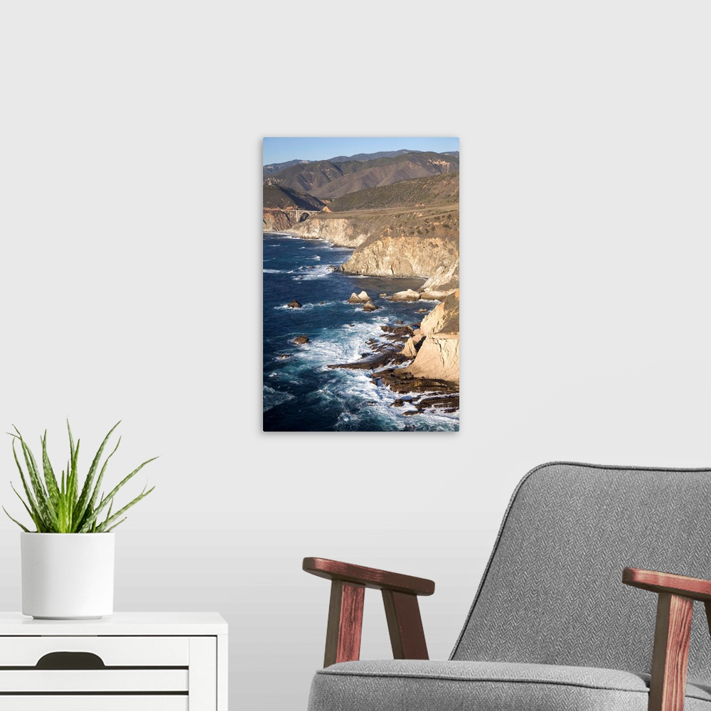 A modern room featuring California, Big Sur. Ragged and rough cliffs drop down to the sweeping coastline on Highway 1, Bi...