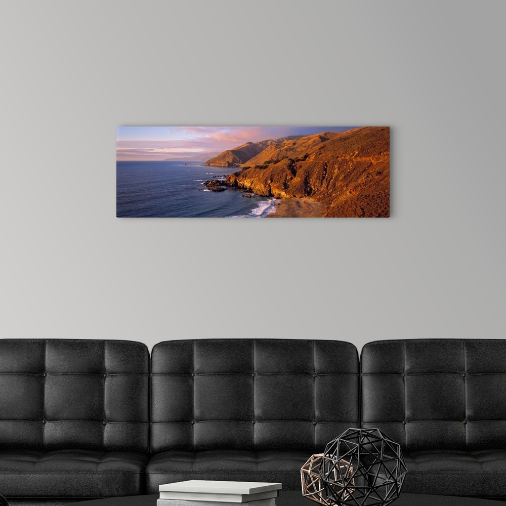 A modern room featuring USA, California, Big Sur. Sunset casts a golden hue over the Coast Range near Big Sur, on Highway...