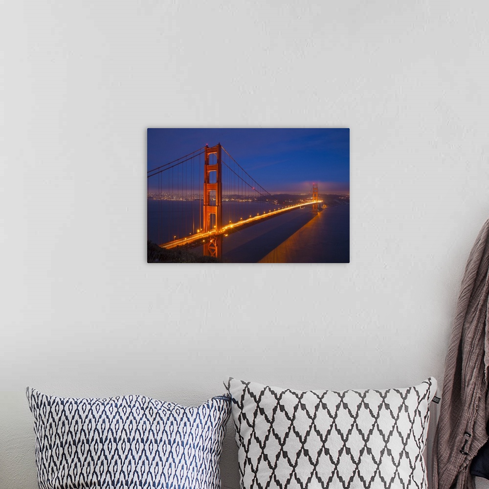 A bohemian room featuring USA, California, San Francisco. Golden Gate Bridge lit at night.
