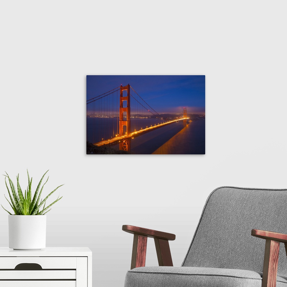 A modern room featuring USA, California, San Francisco. Golden Gate Bridge lit at night.