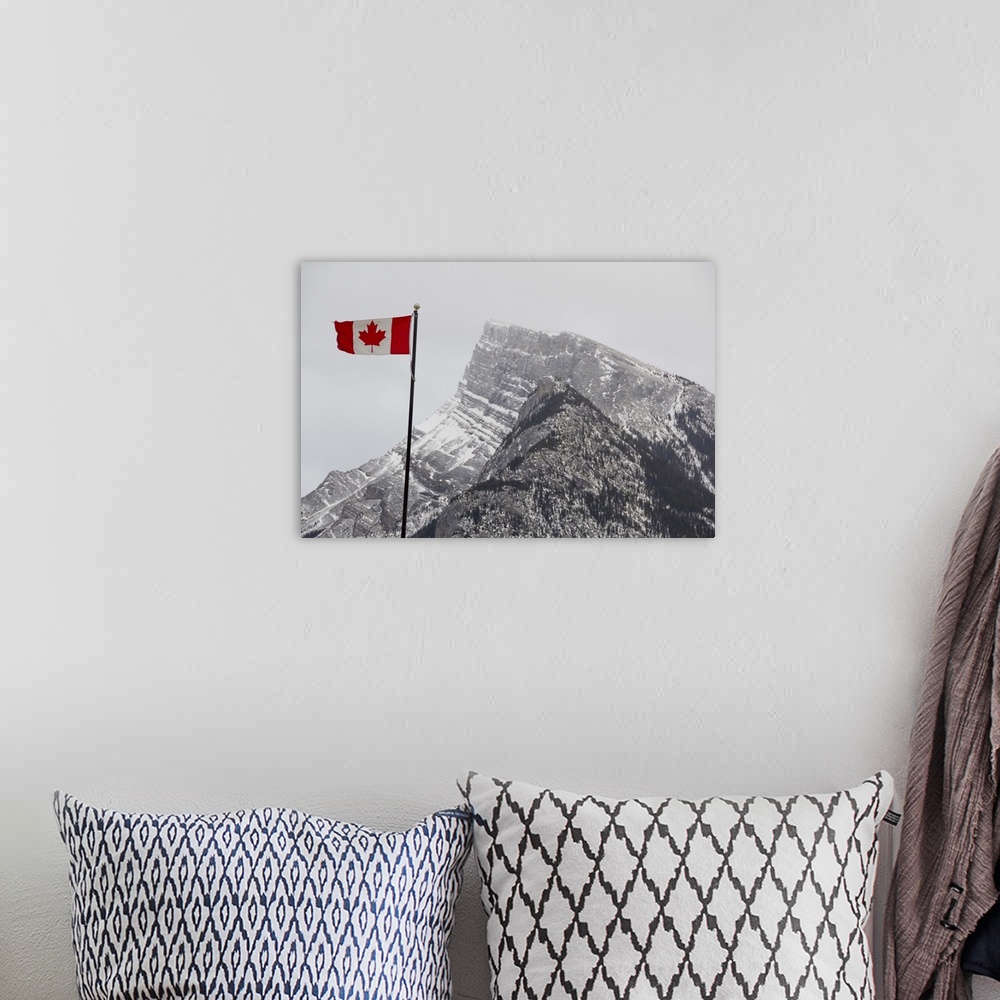 A bohemian room featuring Canada, Alberta, Banff. Mountain view with flag.