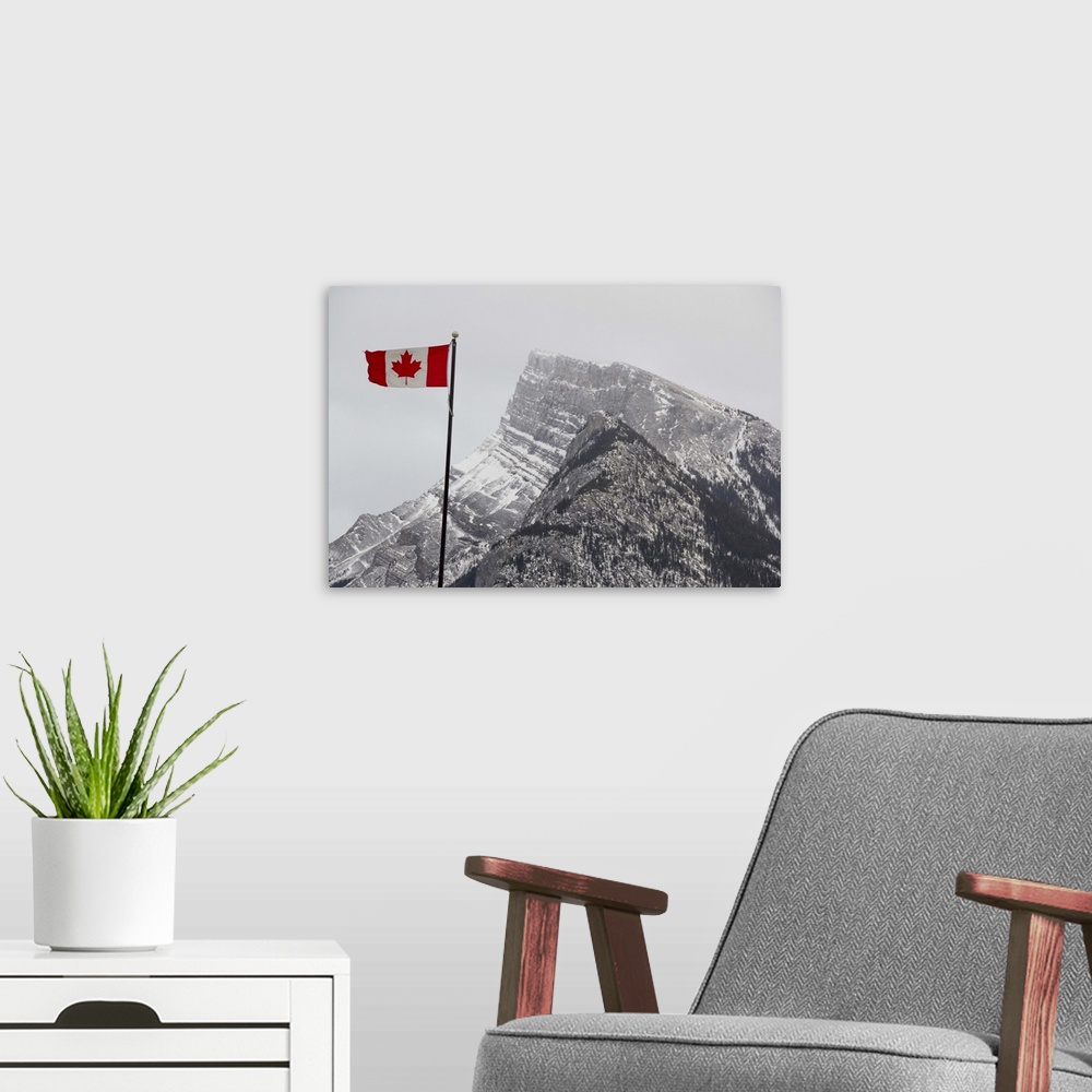 A modern room featuring Canada, Alberta, Banff. Mountain view with flag.