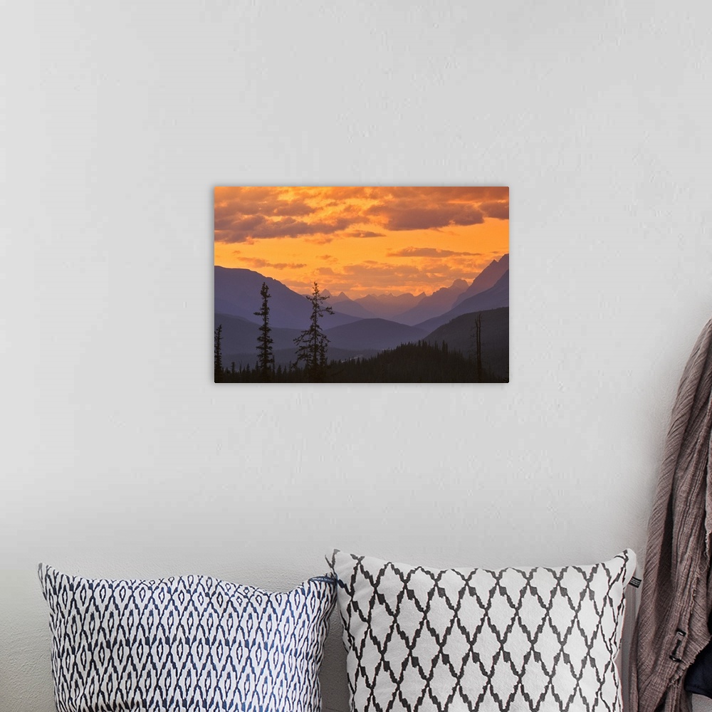 A bohemian room featuring North America, Canada, Alberta, Baniff National Park.  Mountain ridges at sunset near Waterfoul L...