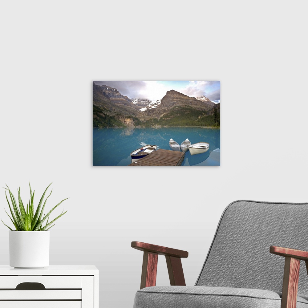A modern room featuring Canada, British Columbia, Yoho National Park. Boats moored at a dock on Lake Ohara. Credit as: Do...
