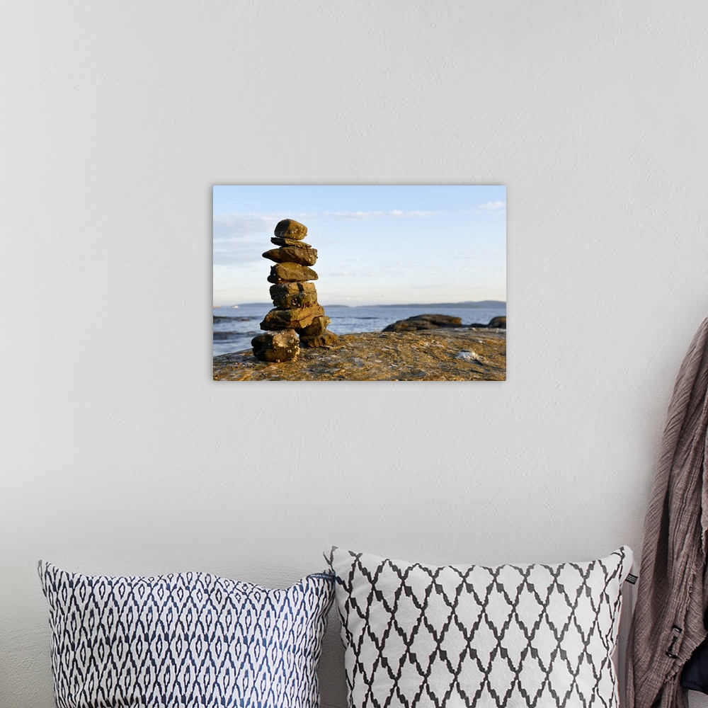A bohemian room featuring Canada, British Columbia, Russell Island. Rock inukshuk in front of Salt Spring Island.