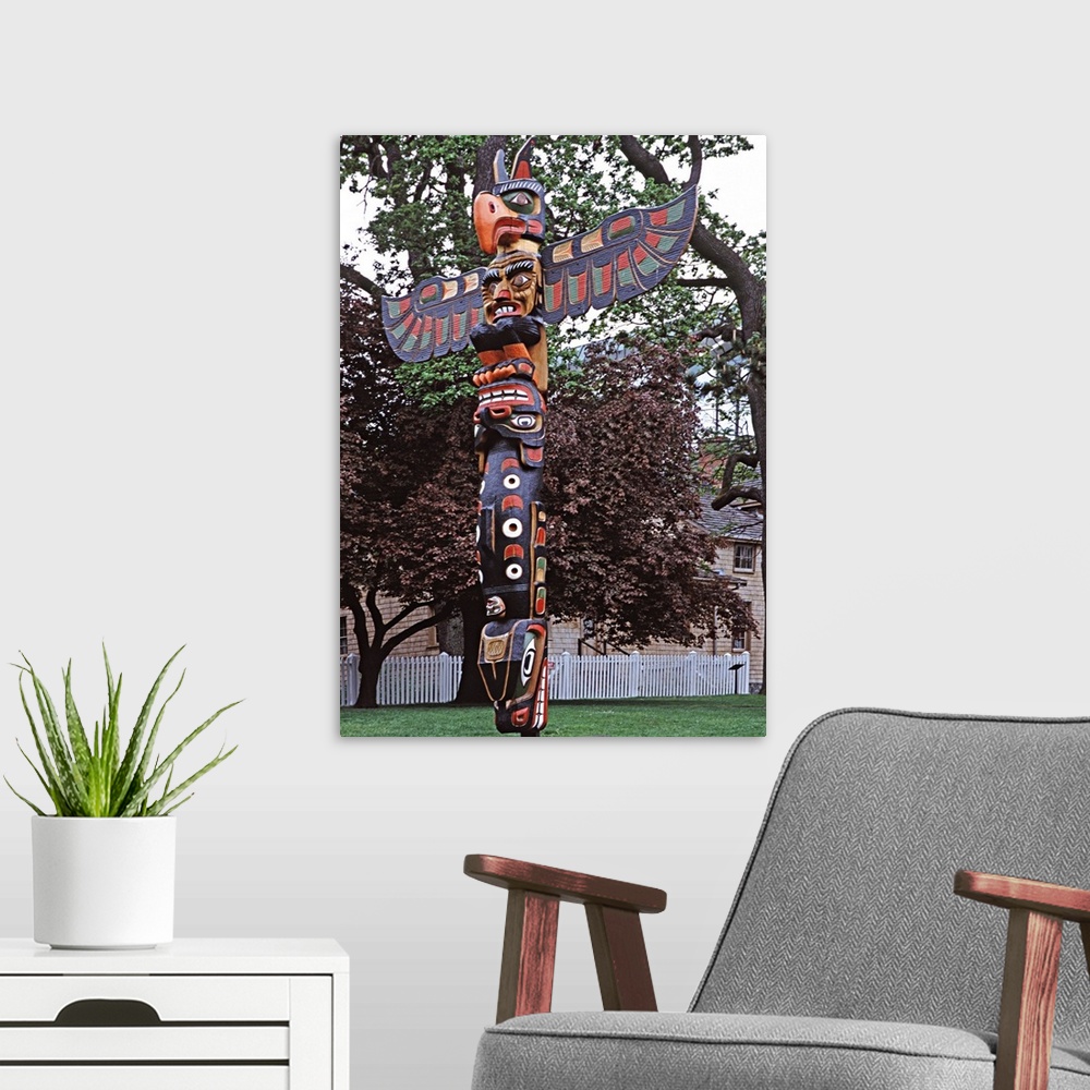 A modern room featuring Canada, British Columbia, Vancouver Island, Victoria. A Kwakiutl totem pole near the Royal Britis...