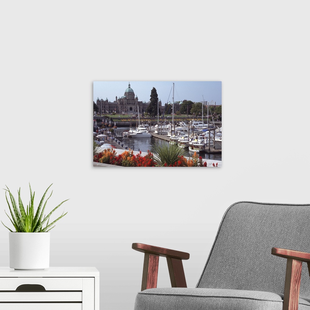 A modern room featuring Canada, British Columbia, Victoria.Parliament Building, with ships and docks in foreground