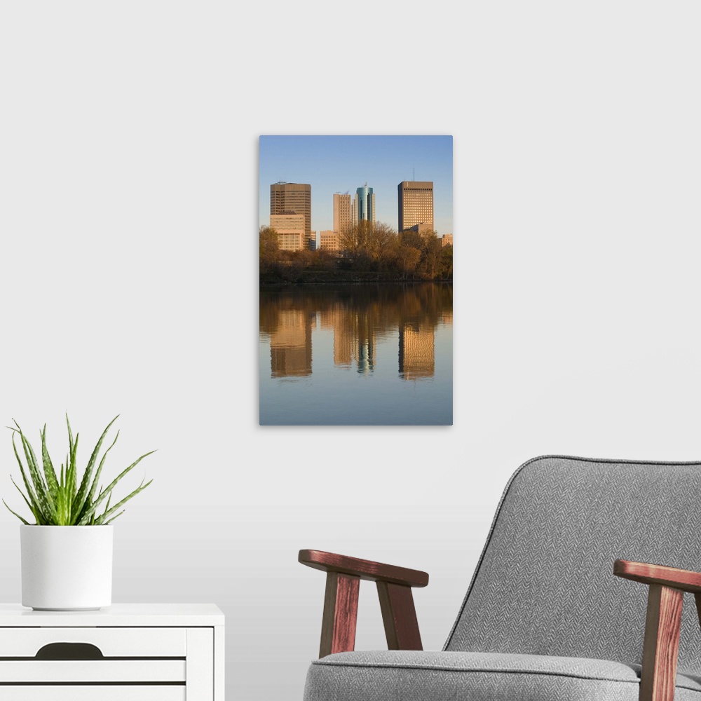 A modern room featuring CANADA-Manitoba-Winnipeg:.Downtown Buildings reflected in the Red River / Dawn