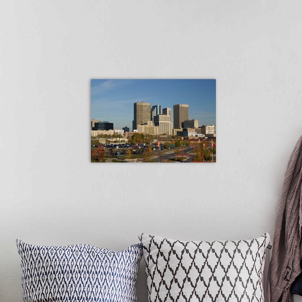 A bohemian room featuring CANADA-Manitoba-Winnipeg:.Downtown Highrise Buildings from The Forks / Daytime