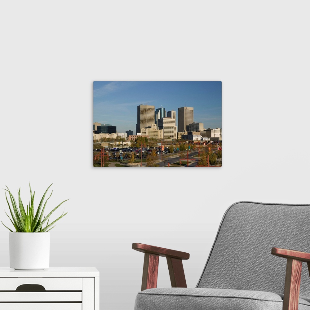 A modern room featuring CANADA-Manitoba-Winnipeg:.Downtown Highrise Buildings from The Forks / Daytime