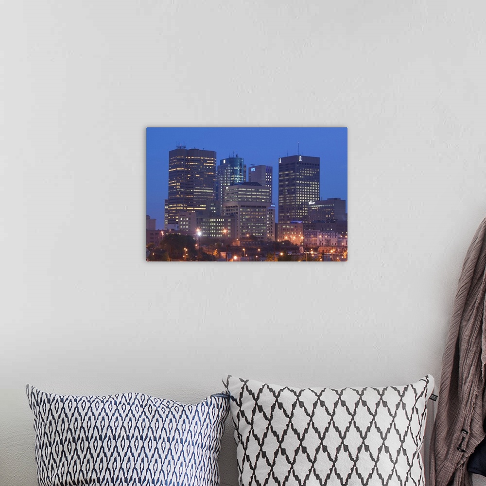 A bohemian room featuring CANADA-Manitoba-Winnipeg:.Downtown Highrises from The Forks Area- Dawn