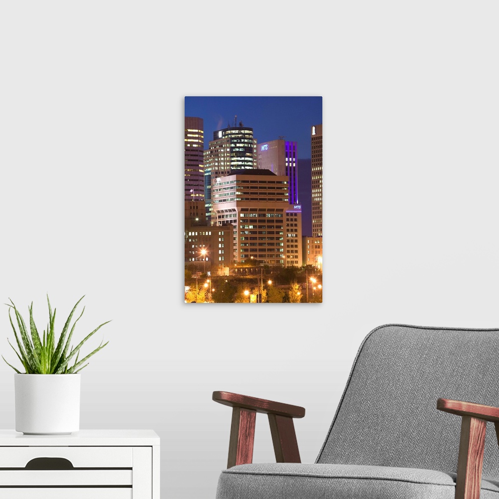 A modern room featuring CANADA-Manitoba-Winnipeg:.Highrises of Downtown Winnipeg from the Forks / Evening