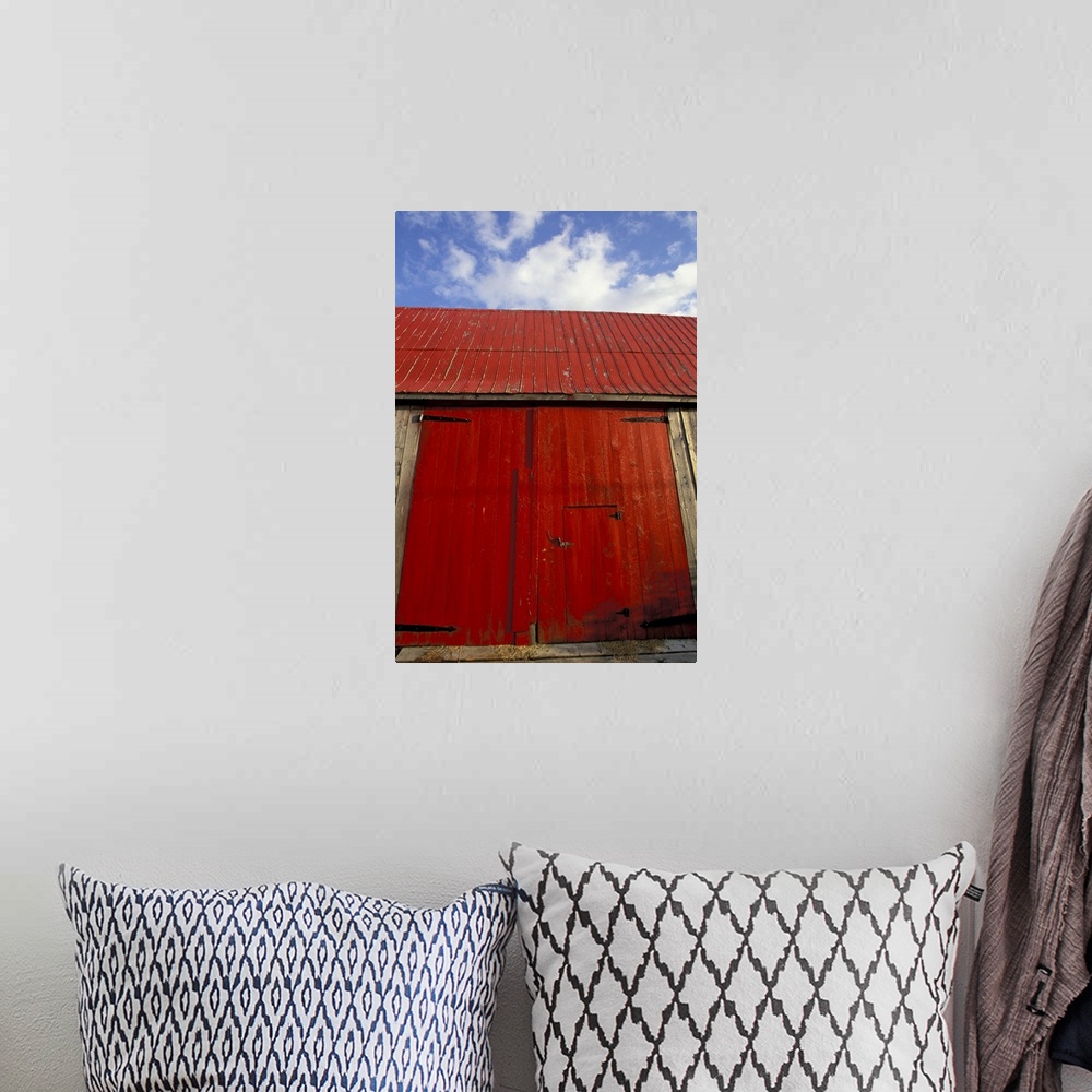 A bohemian room featuring NA, Canada, New Brunswick, Shepody.Red barn door