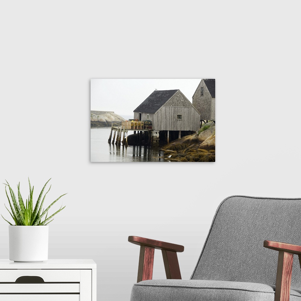 A modern room featuring Canada, Nova Scotia, Peggy's Cove. Lobster traps on typical wooden dock.