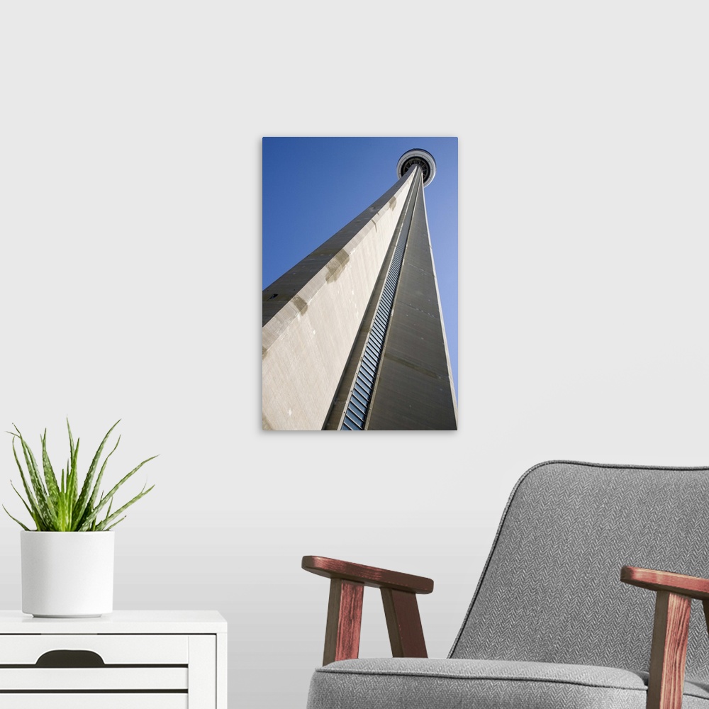 A modern room featuring Canada, Ontario, Toronto. View looking up at CN Tower, world's tallest structure of 1,815 feet. C...