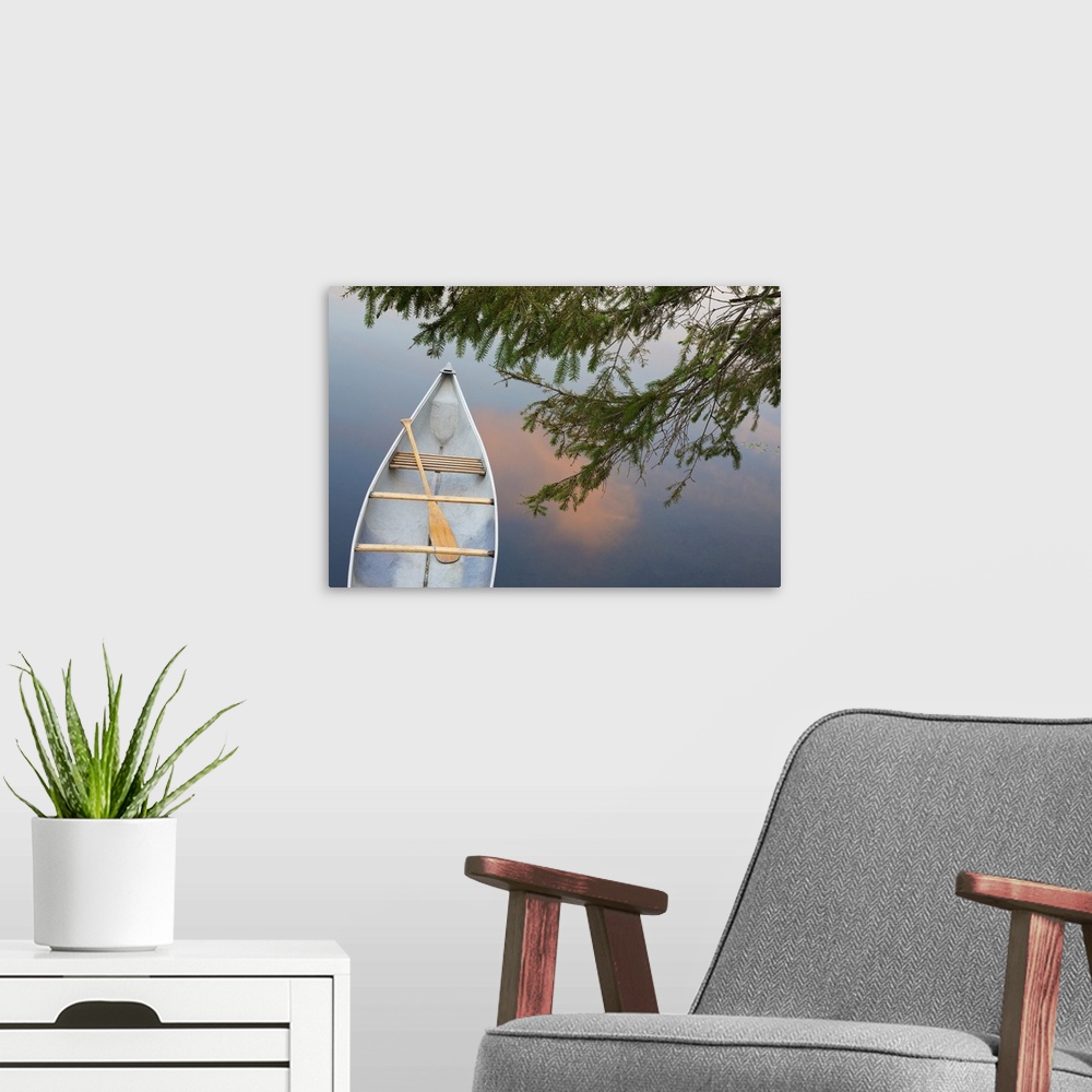 A modern room featuring Canada, Quebec, Eastman. Canoe on lake at sunset.
