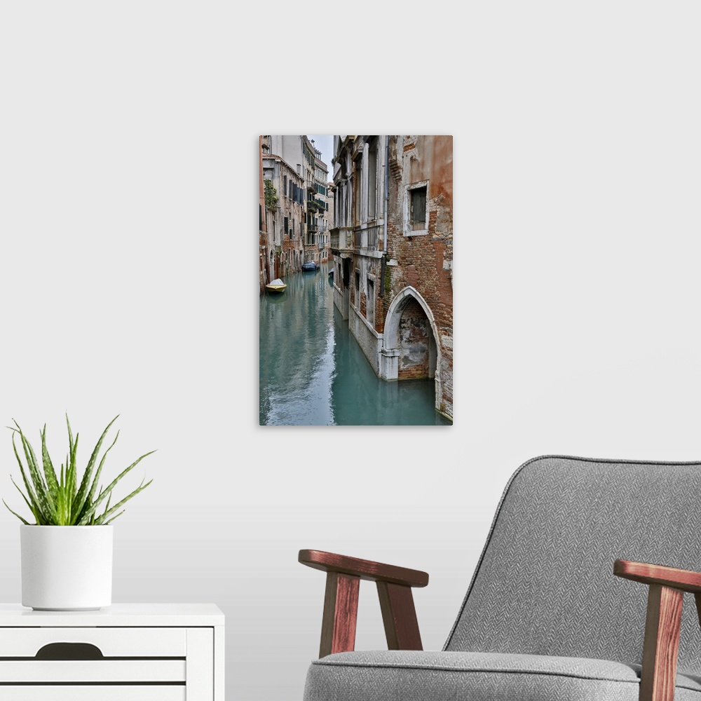 A modern room featuring Canal and Bridges with boats, Venice, Italy.