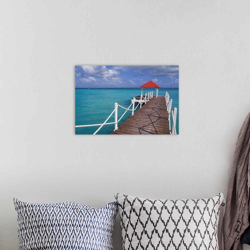 A bohemian room featuring Caribbean, Guadeloupe. Colorful dock and crystal blue water