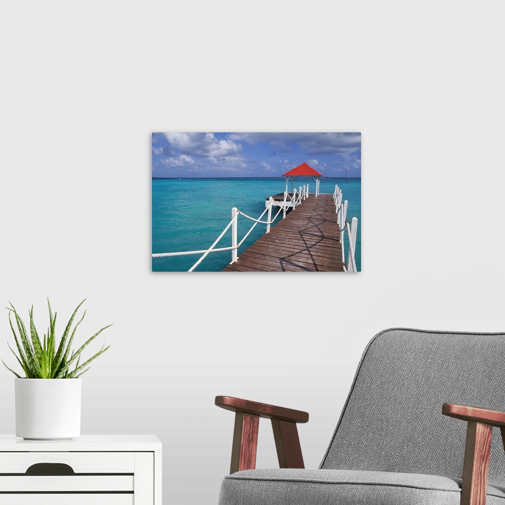 A modern room featuring Caribbean, Guadeloupe. Colorful dock and crystal blue water