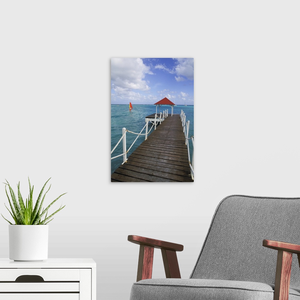 A modern room featuring Caribbean, Guadeloupe. Colorful dock and crystal blue water