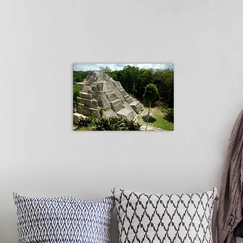 A bohemian room featuring Central America, Guatemala, Yaxha. Classic Mayan pyramid surrounded by jungle.