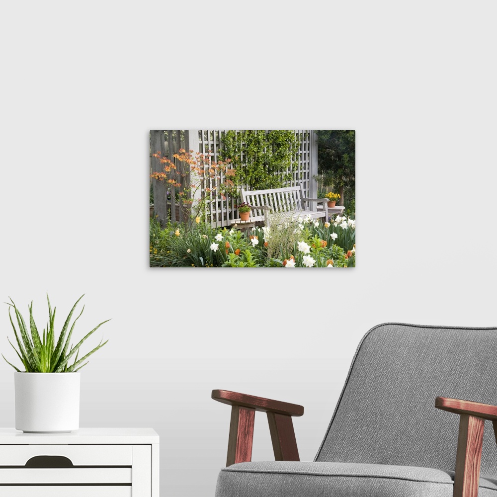 A modern room featuring USA, Georgia, Pine Mountain. Chair in the patio area of a flower garden.