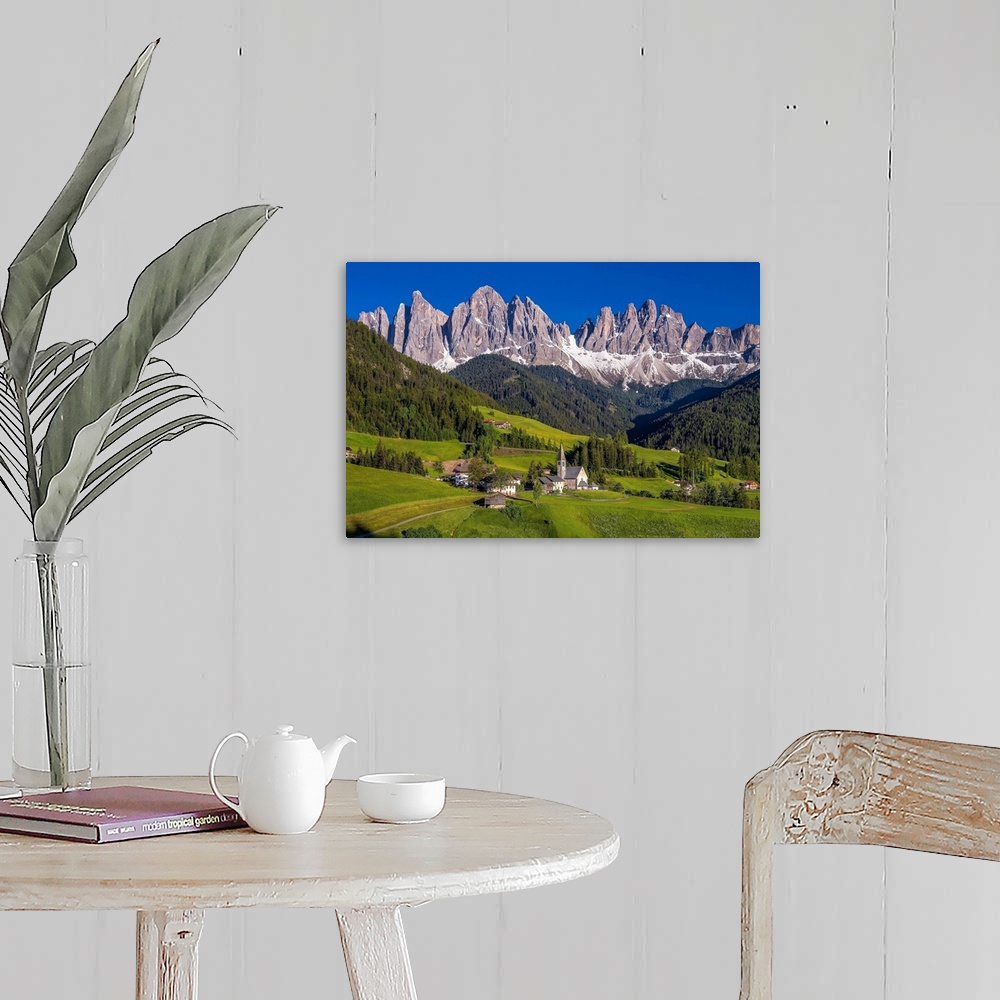 A farmhouse room featuring Italy, Dolomites, Val di Funes. Chapel of St. Magdalena in village. Credit: Jim Nilsen