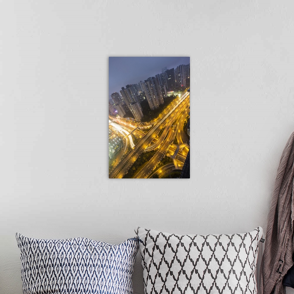 A bohemian room featuring China, Chongqing, Traffic on expressways surrounded by apartment towers at dusk.