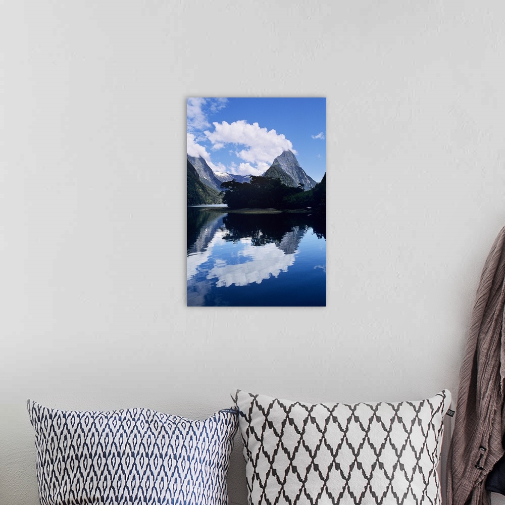 A bohemian room featuring Cloud-capped Mitre Peak rises out of Milford Sound in Fiordland National Park, South Island, New ...