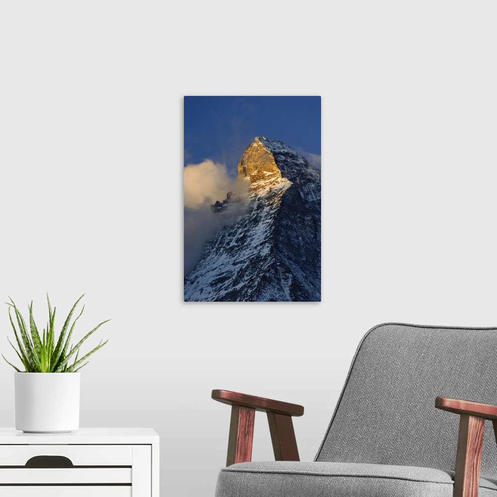 A modern room featuring Clouds around the summit of the Matterhorn at sunrise, Zermatt, Switzerland