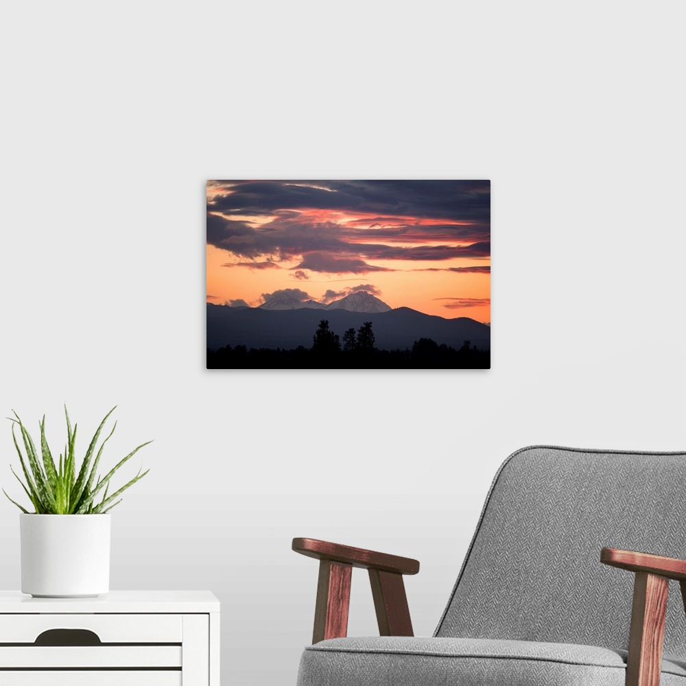A modern room featuring USA, Oregon, Bend. Clouds gather around the Soth and Middle Sisters at sunset in Deschutes County...